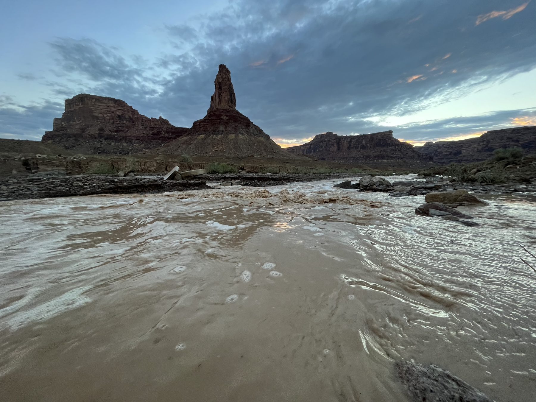 Desert tower above muddy river