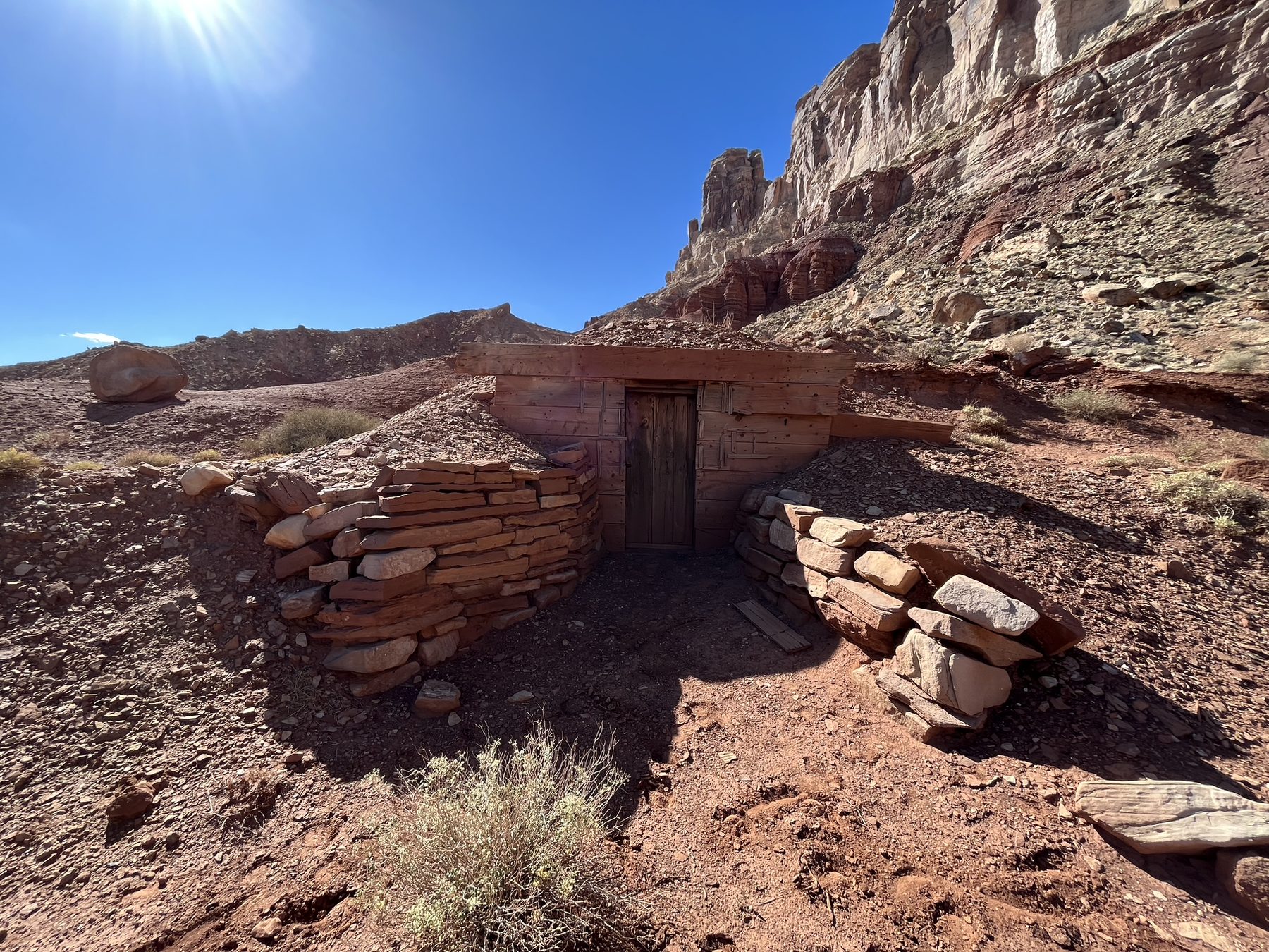 Stone cabin remains near canyon walls