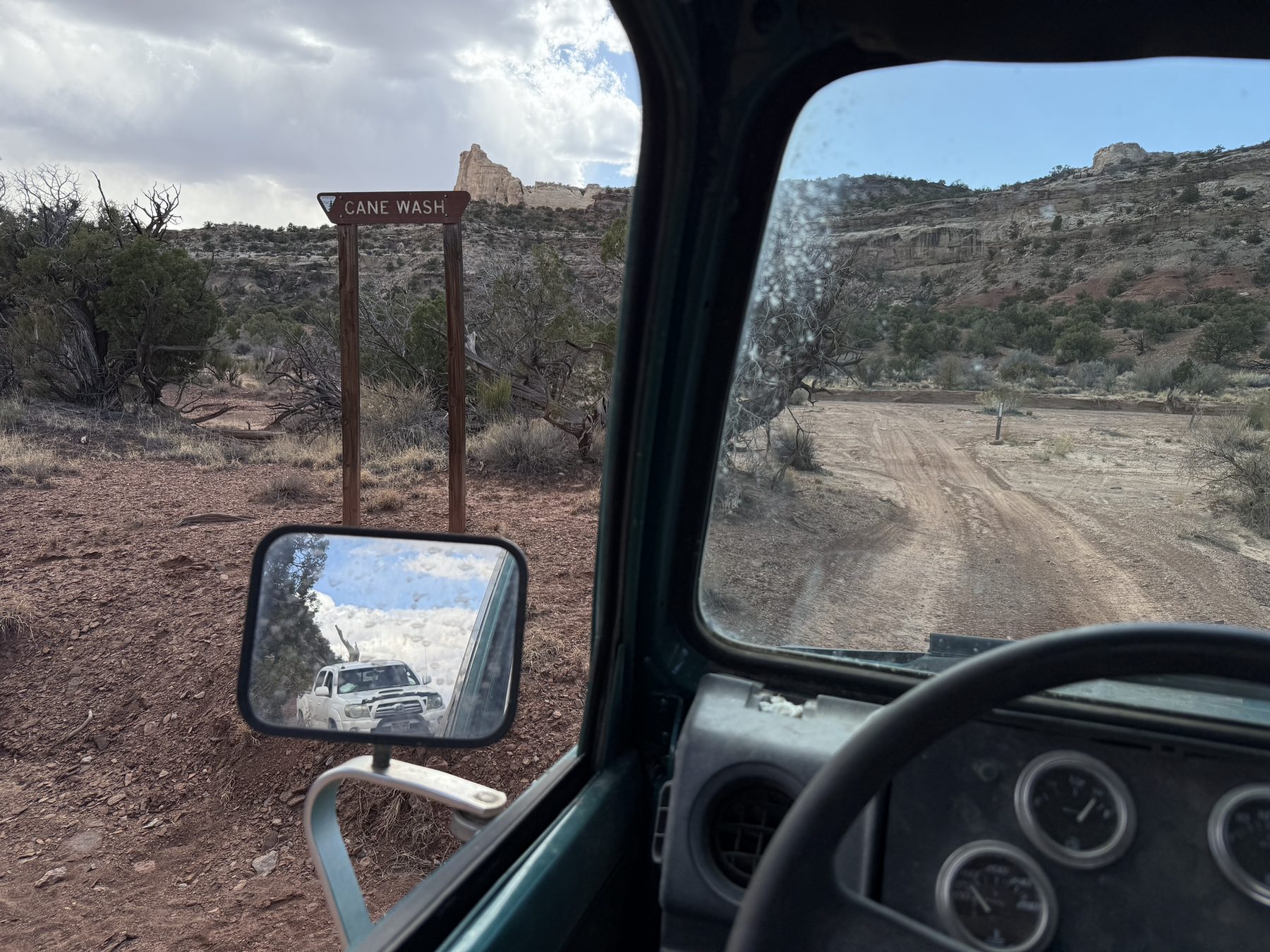 View from inside a vehicle on a desert road
